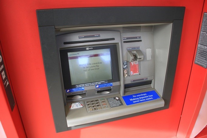 a picture of a red ATM